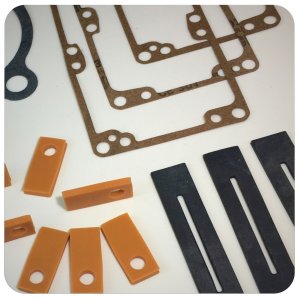 A collection of rounded edge, multicolored, custom gaskets produced by Accurate Felt & Gasket
